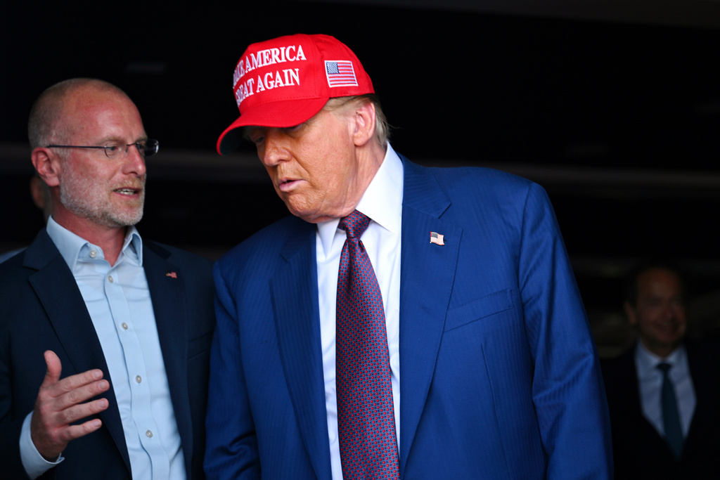 FILE - President-elect Donald Trump talks with Brendan Carr before the launch of the sixth test flight of the SpaceX Starship rocket Tuesday, Nov. 19, 2024 in Boca Chica, Texas. (Brandon Bell/Pool via AP, File)