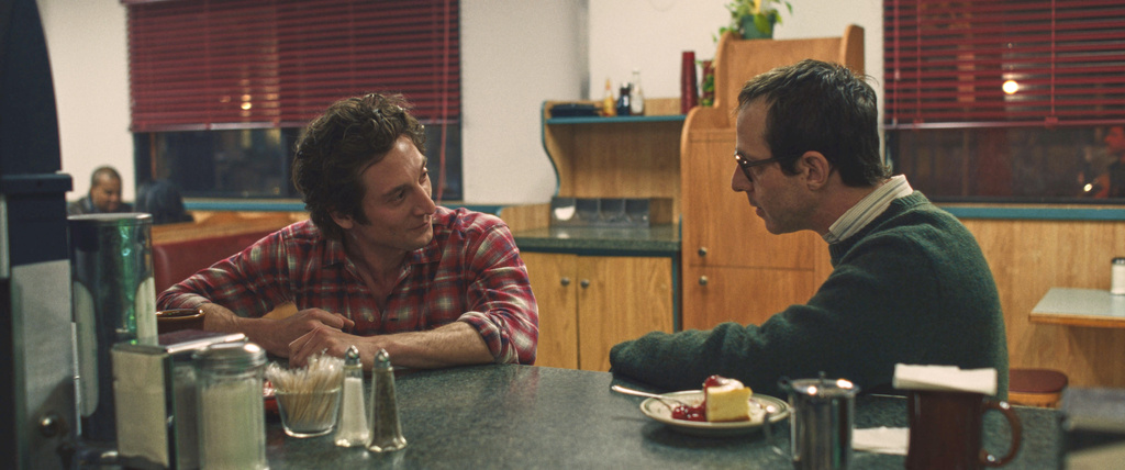 This image released by Disney shows Jeremy Allen White as Bruce Springsteen, left, and and Jeremy Strong as Jon Landau, in a scene from "Springsteen: Deliver Me From Nowhere." (Macall Polay/20th Century Studios via AP)