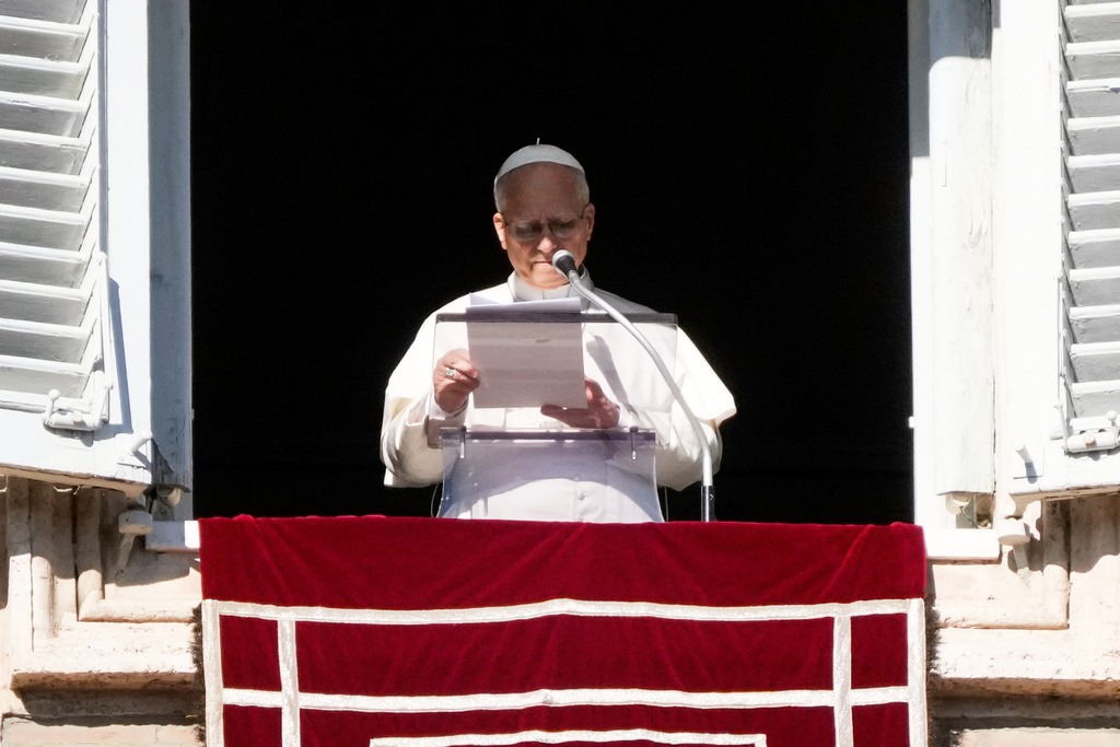 Pope Leo XIV delivers the Angelus noon prayer in St. Peter's Square at the Vatican, Sunday, Jan. 11, 2026. (AP Photo/Gregorio Borgia)