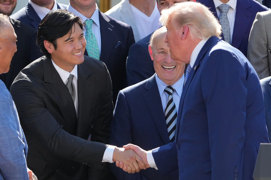 President Donald Trump shakes hands with Los Angeles Dodgers Shohei Ohtani during an event to honor the 2025 World Series champions Los Angeles Dodgers in the Rose Garden of the White House, Thursday, July 23, 2026, in Washington. (AP Photo/Alex Brandon)
