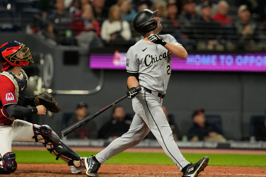 Chicago White Sox's Tristan Peters, right, and Cleveland Guardians catcher Patrick Bailey, left, watch a foul ball hit by Peters in the sixth inning of a baseball game in Cleveland, Monday, Sept. 14, 2026. (AP Photo/Sue Ogrocki)
