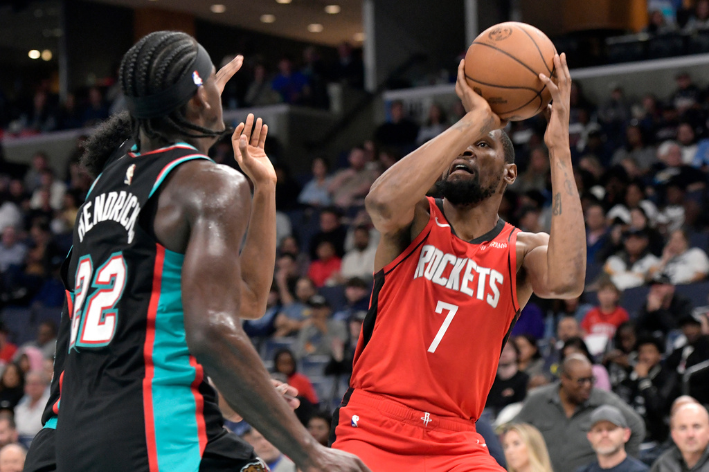 Houston Rockets forward Kevin Durant (7) looks to shoot against Memphis Grizzlies forward Taylor Hendricks (22) in the first half of an NBA basketball game Friday, March 27, 2026, in Memphis, Tenn. (AP Photo/Brandon Dill)
