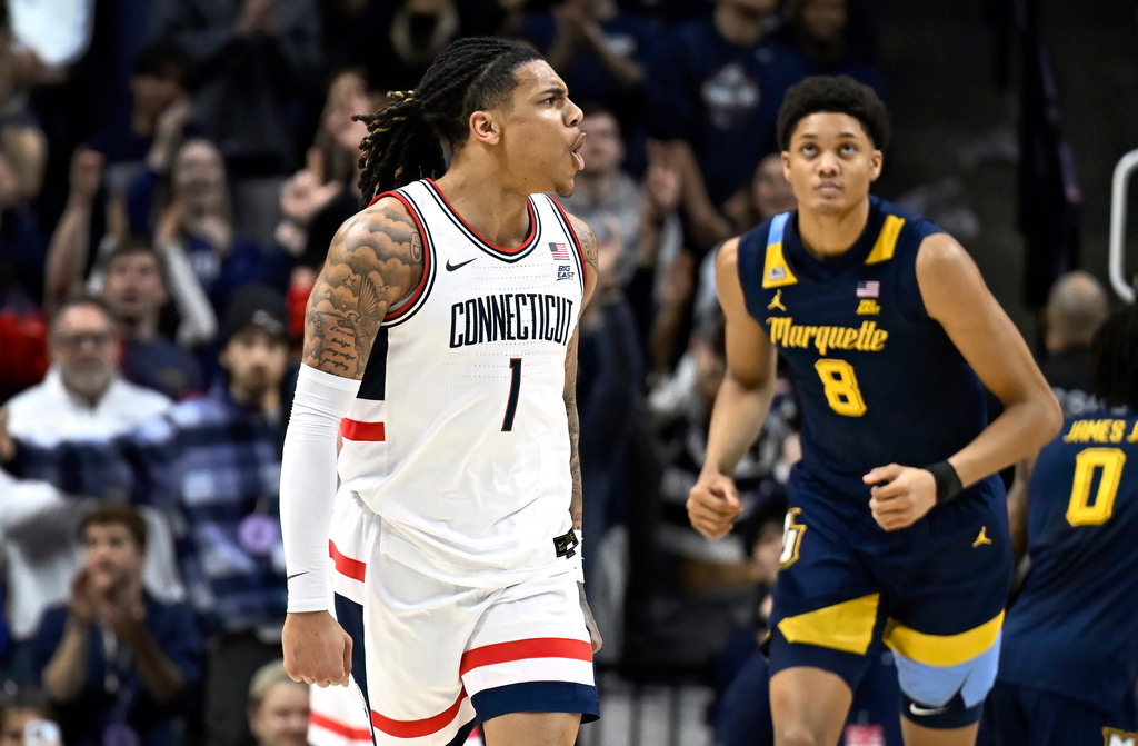 UConn guard Solo Ball (1) reacts in the first half of an NCAA college basketball game against Marquette, Sunday, Jan. 4, 2026, in Storrs, Conn. (AP Photo/Jessica Hill)
