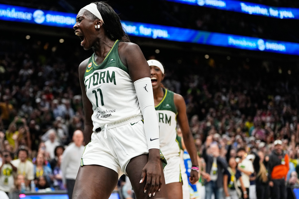 Seattle Storm center Awa Fam reacts after blocking Dallas Wings' Paige Bueckers at the basket during overtime in a WNBA basketball game, Monday, June 22, 2026, in Seattle. (AP Photo/Lindsey Wasson)