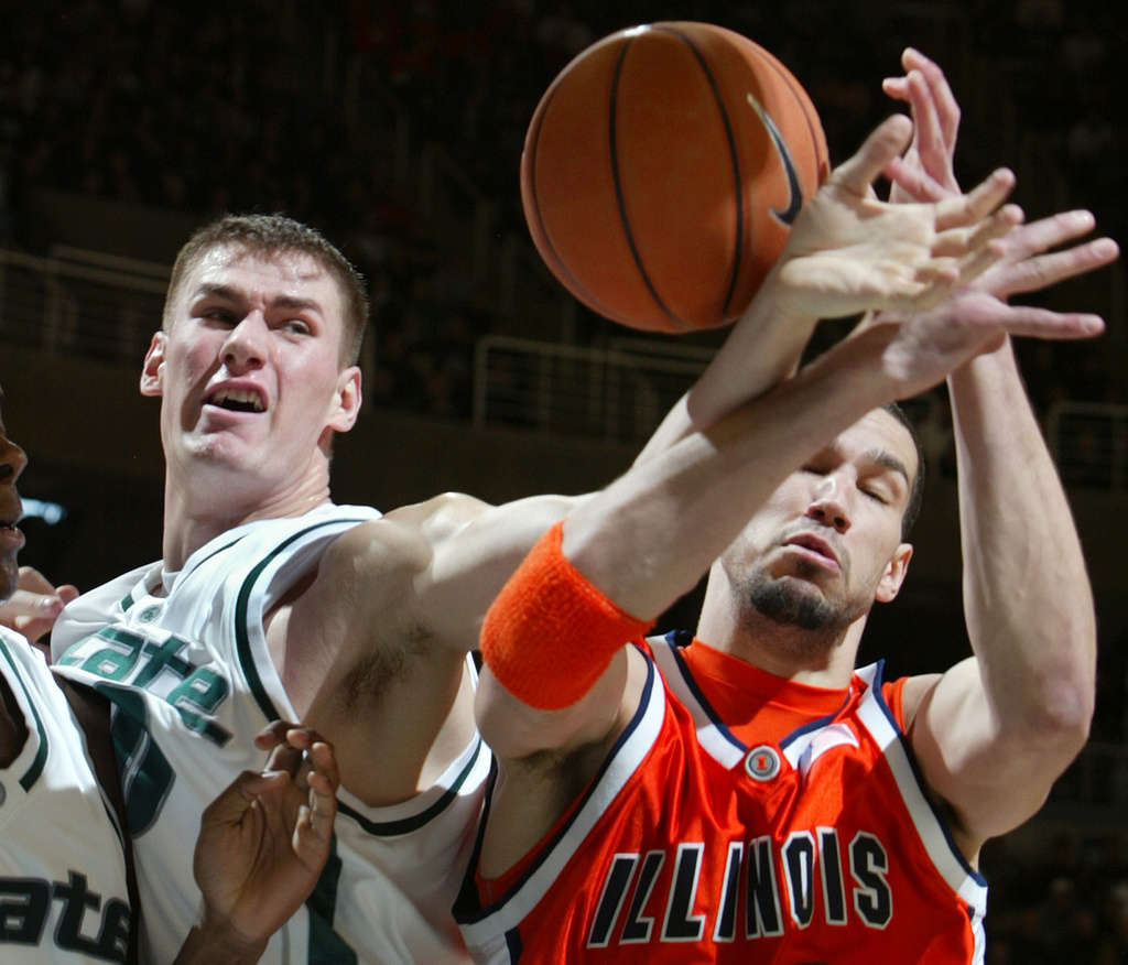 FILE - Michigan State's Paul Davis, left, and Illinois' James Augustine fight for a rebound during the first half of a college basketball game, March 4, 2006, in East Lansing, Mich. (AP Photo/Al Goldis, File)