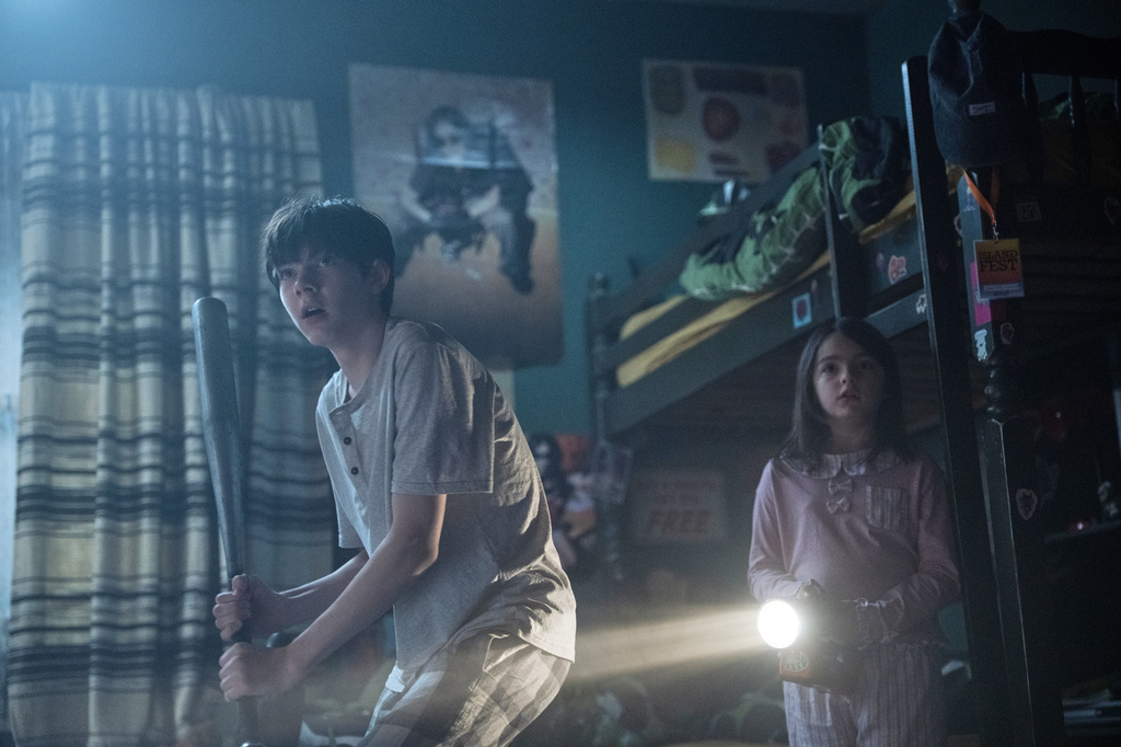 This image released by Warner Bros. Pictures shows Shylo Molina, left, and Billie Roy in a scene from "Lee Cronin's The Mummy." (Warner Bros. Pictures via AP)