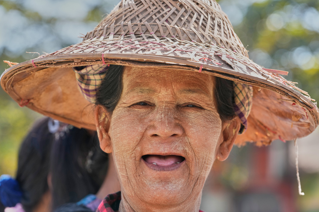 A woman lines up to cast her vote at a polling station in Naypyitaw, Myanmar, Sunday, Dec. 28, 2025. (AP Photo/Aung Shine Oo)