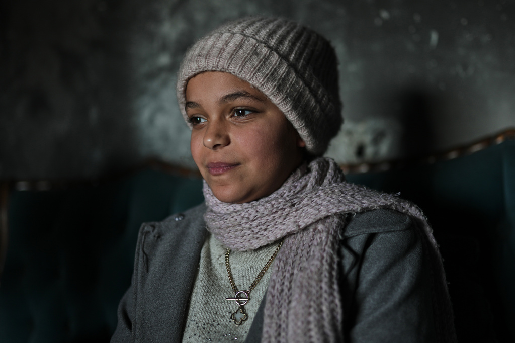 Razan Sharif Hamdi Shanan, 10, the sole survivor of an Israeli airstrike that killed her parents and siblings, poses for a photo at the home where she is staying with relatives in Gaza City, Monday, Jan. 19, 2026. (AP Photo/Jehad Alshrafi)