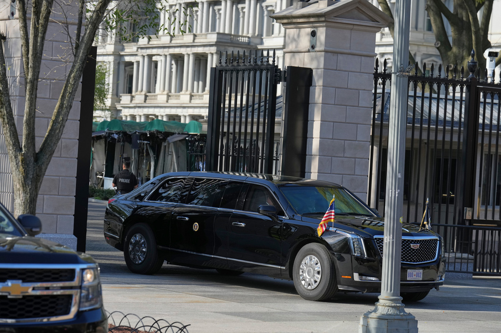 President Donald Trump's limo exits the White House en route to the Supreme Court, Wednesday, April 1, 2026, in Washington. (AP Photo/Mark Schiefelbein)