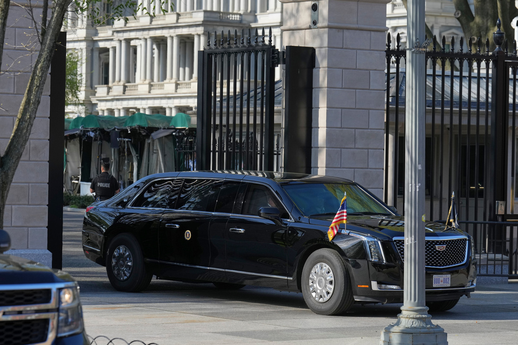 President Donald Trump's limo exits the White House en route to the Supreme Court, Wednesday, April 1, 2026, in Washington. (AP Photo/Mark Schiefelbein)
