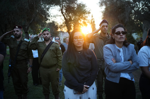 People attend a memorial service marking two years since the Oct. 7, 2023, Hamas cross-border attack on Israel, in Kibbutz Kfar Aza, southern Israel where many of its community members were Killed and abducted, Tuesday, Oct. 7, 2025. (AP Photo/Ohad Zwigenberg) People attend a memorial service marking two years since the Oct. 7, 2023, Hamas cross-border attack on Israel, in Kibbutz Kfar Aza, southern Israel where many of its community members were Killed and abducted, Tuesday, Oct. 7, 2025. (AP Photo/Ohad Zwigenberg)