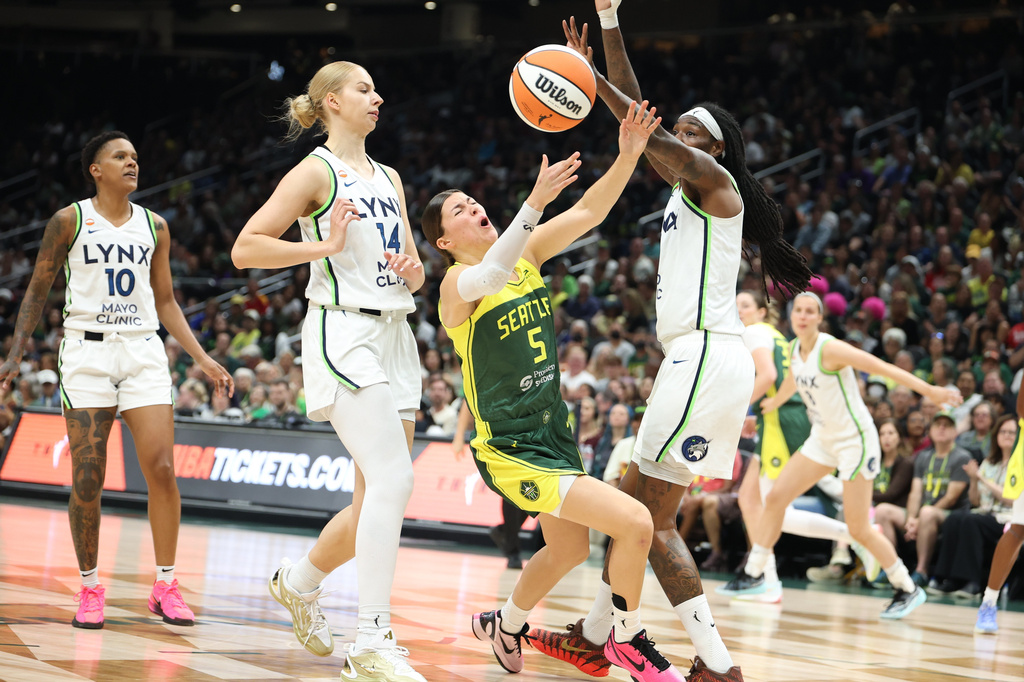 Seattle Storm guard Jade Melbourne (5) is fouled by Minnesota Lynx forward Natasha Howard during the first half of a WNBA basketball game Monday, July 20, 2026, in Seattle. (Dean Rutz/The Seattle Times via AP)