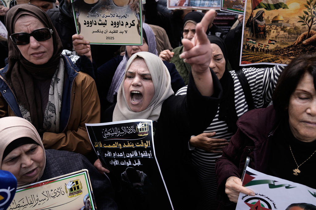 Palestinians demonstrate against the decision by Israel's parliament to approve the death penalty for Palestinians convicted of murdering Israelis in Nablus, West Bank, Tuesday, March 31, 2026. (AP Photo/Majdi Mohammed)