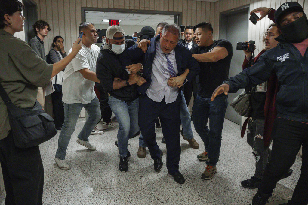 New York City Comptroller Brad Lander is placed under arrest by Immigration and Customs Enforcement (ICE) and FBI agents outside federal immigration court on Tuesday, June 17, 2025, in New York. (AP Photo/Olga Fedorova)