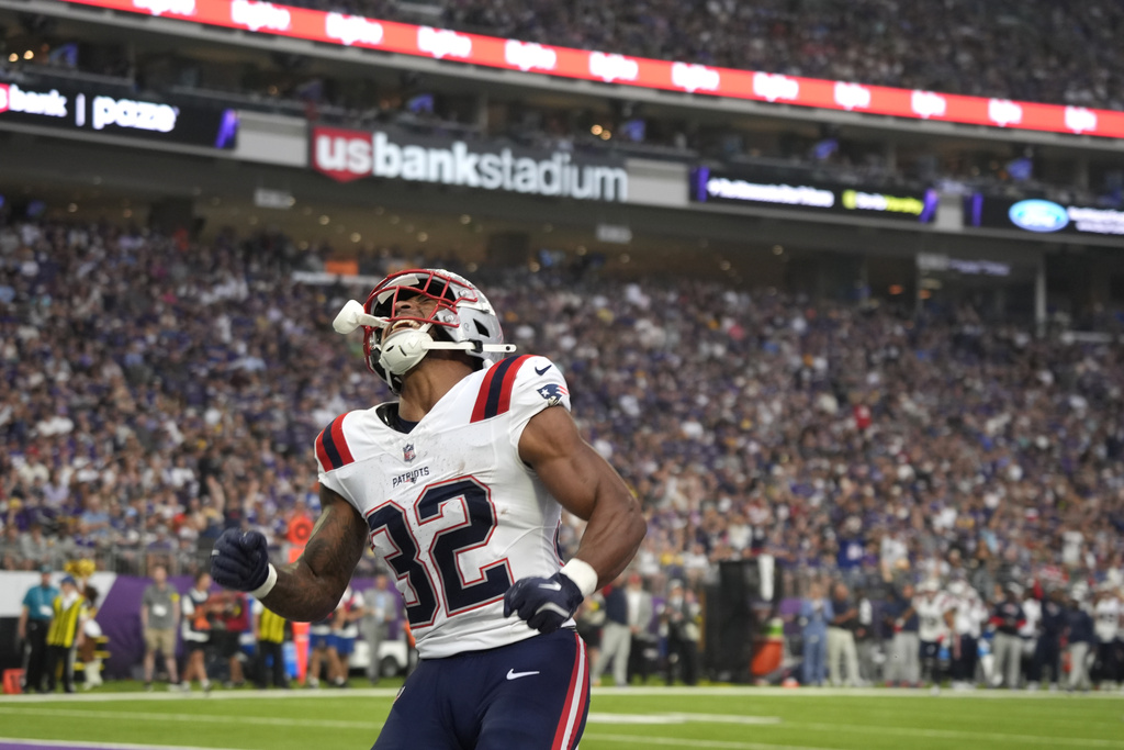 New England Patriots running back TreVeyon Henderson (32) celebrates after scoring during the first half of a preseason NFL football game against the Minnesota Vikings Saturday, Aug. 16, 2025, in Minneapolis. (AP Photo/Bruce Kluckhohn)