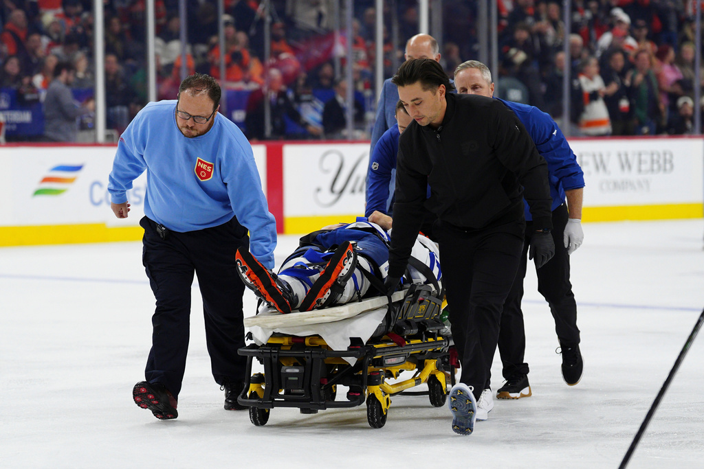 Toronto Maple Leafs' Chris Tanev is taken off the ice on a stretcher by medical staff after a collision during the third period of an NHL hockey game against the Philadelphia Flyers, Saturday, Nov. 1, 2025, in Philadelphia. (AP Photo/Derik Hamilton)