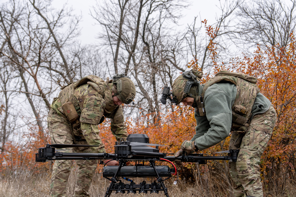 Ukrainian soldiers with the Kraken 1654 unit prepare a Vampire drone before a demonstration for The Associated Press, Wednesday, Nov. 5, 2025, in Kharkiv Oblast, Ukraine. (AP Photo/Julia Demaree Nikhinson)