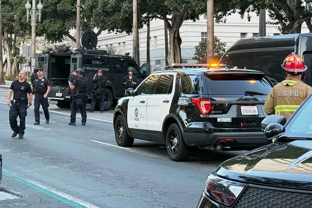 Law enforcement respond after a car crashed into Los Angeles City Hall on Friday, Oct. 3, 2025. (AP Photo/Jaimie Ding)