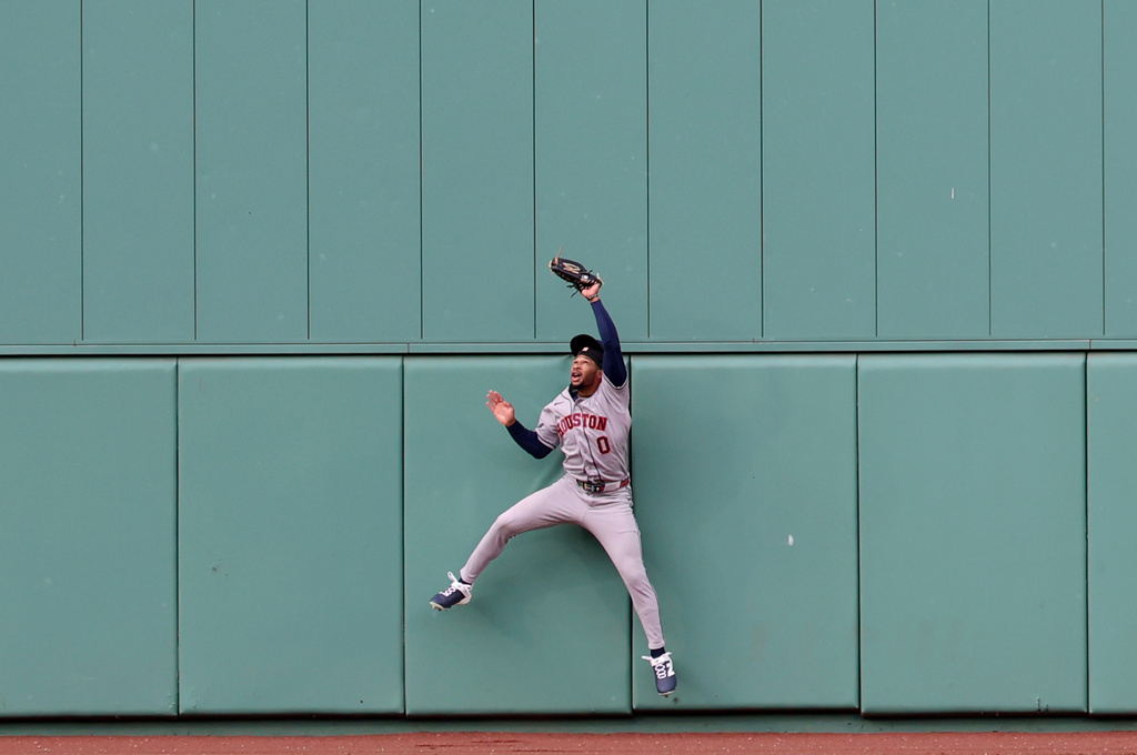 Houston Astros center fielder Brice Matthews catches the ball on a sacrifice fly hit by Boston Red Sox's Willson Contreras during the fifth inning of a baseball game, Saturday, May 2, 2026, in Boston. (AP Photo/Mark Stockwell)