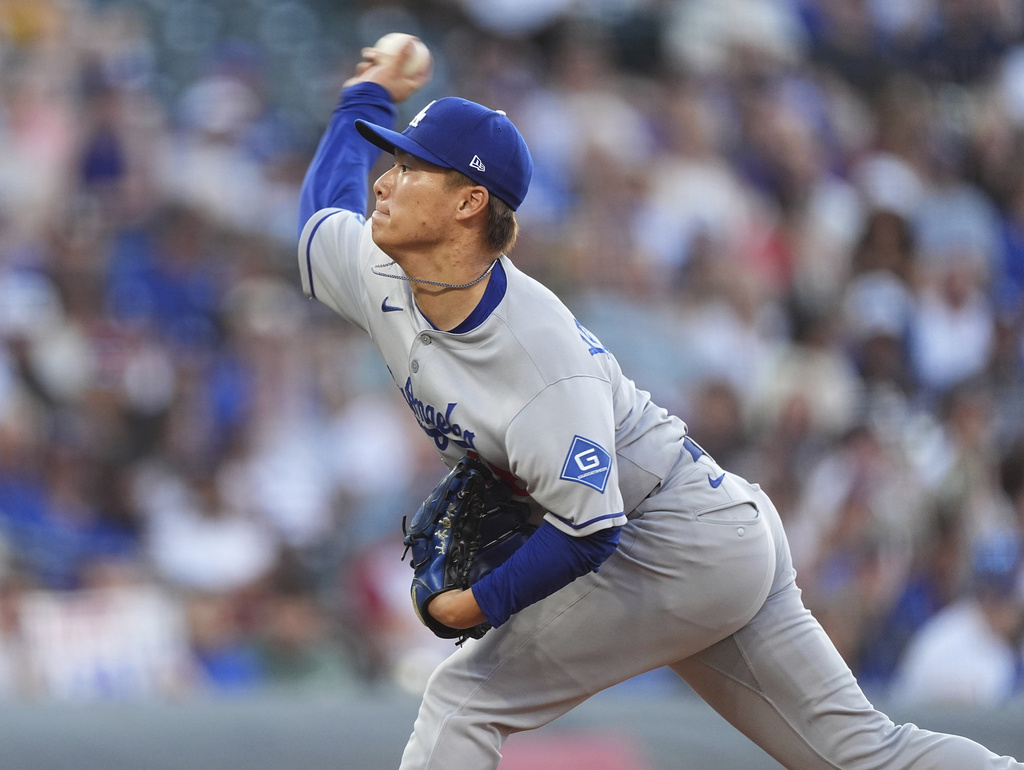 Los Angeles Dodgers starting pitcher Yoshinobu Yamamoto works against the Colorado Rockies in the first inning of a baseball game, Monday, Aug. 18, 2025, in Denver. (AP Photo/David Zalubowski)
