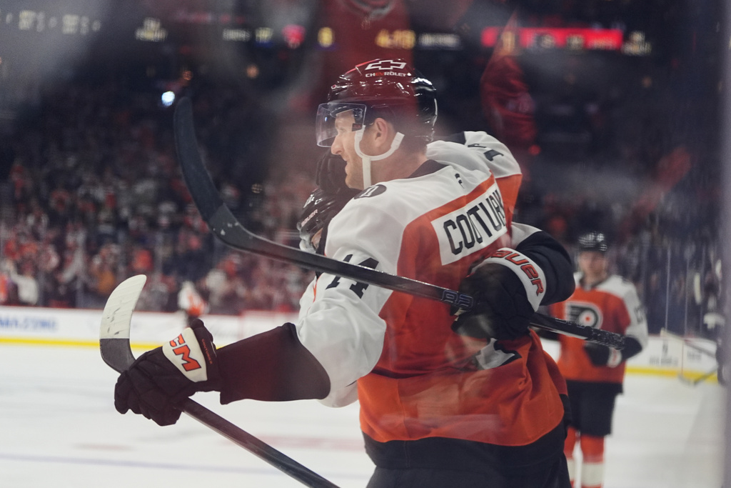 Philadelphia Flyers' Sean Couturier celebrates after scoring past Florida Panthers goaltender Daniil Tarasov during the second period of an NHL hockey game, Monday, Oct. 13, 2025, in Philadelphia. (AP Photo/Matt Rourke)
