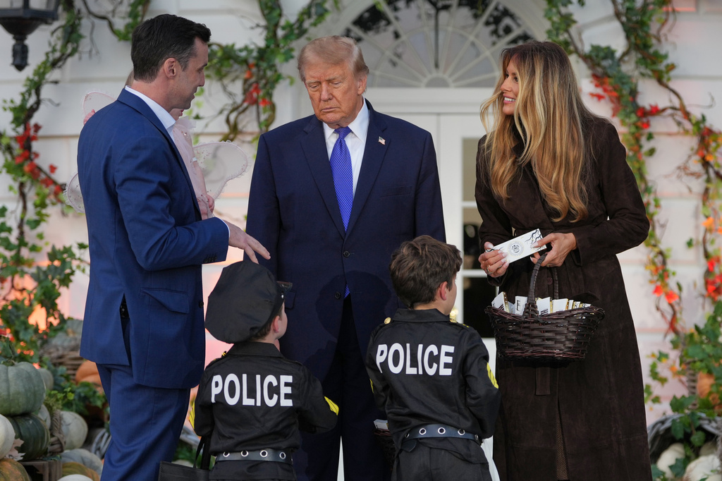 President Donald Trump and first lady Melania Trump attend a Halloween event on the South Lawn of the White House, Thursday, Oct. 29, 2026, in Washington. (AP Photo/Mark Schiefelbein)