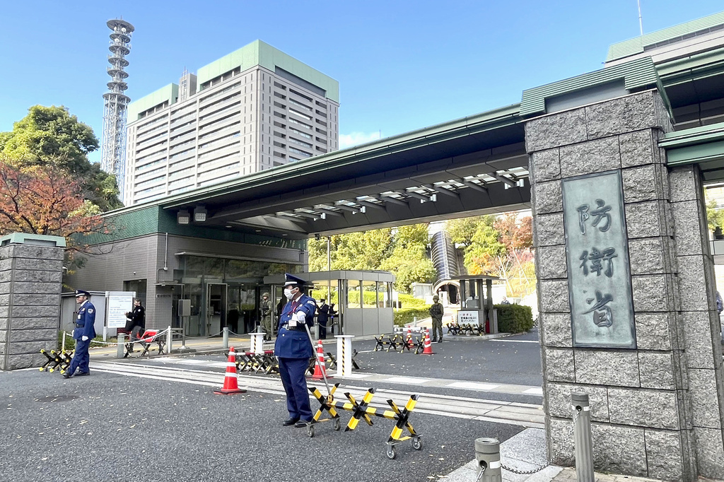 Security guards the entrance of Japan's Defense Ministry in Tokyo, on Nov. 19, 2025. (Kyodo News via AP)
