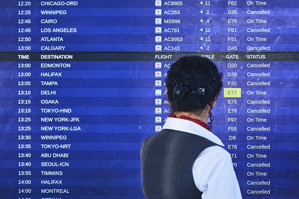 Air Canada flights show as cancelled at Pearson International Airport as flight attendants go on strike in Toronto on Saturday, Aug. 16, 2025. (Sammy Kogan/The Canadian Press via AP)