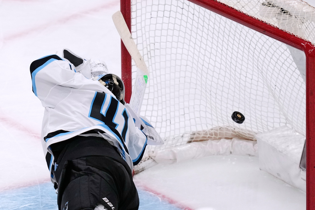 Utah Mammoth goaltender Vitek Vanecek dives back but can't make the save on a goal by Boston Bruins center Morgan Geekie during the first period of an NHL hockey game, Tuesday, Dec. 16, 2025, in Boston. (AP Photo/Charles Krupa)