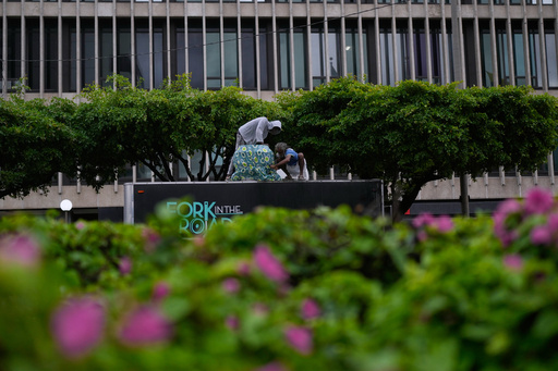 Men cover the top of a food truck ahead of the forecast arrival of Hurricane Melissa in Kingston, Jamaica, Sunday, Oct. 26, 2025. (AP Photo/Matias Delacroix) Men cover the top of a food truck ahead of the forecast arrival of Hurricane Melissa in Kingston, Jamaica, Sunday, Oct. 26, 2025. (AP Photo/Matias Delacroix)