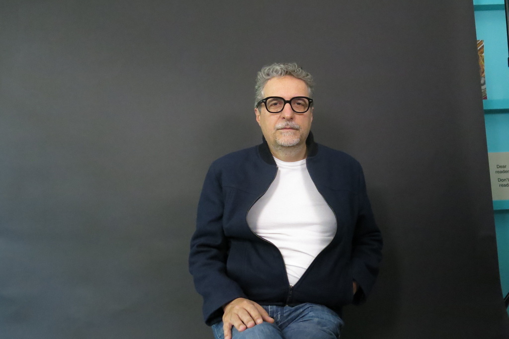 Brazilian filmmaker Kleber Mendonça Filho, director of the Oscar nominated film The Secret Agent, poses for a portrait in Mexico City, Dec. 9, 2025. (AP Photo/Berenice Bautista)