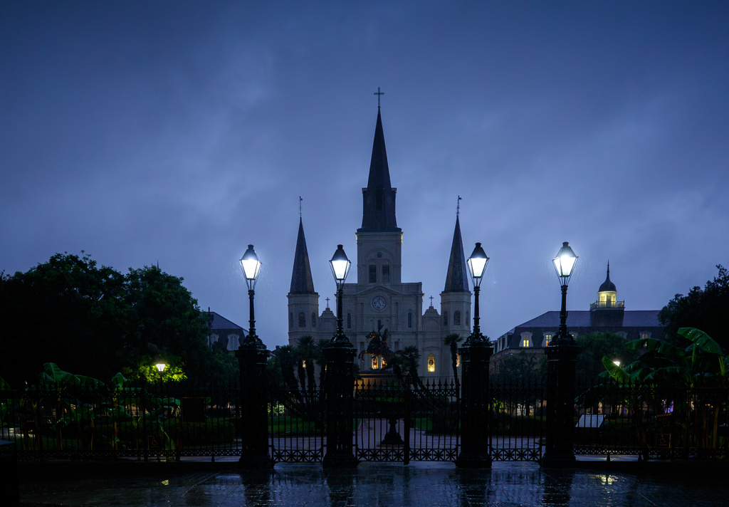 Lightning flashes behind St. Louis Cathedral in Jackson Square as rain falls in New Orleans during Tropical Storm Arthur.in New Orleans, Thursday, June 18, 2026. (David Grunfeld/The Times-Picayune/The New Orleans Advocate via AP)