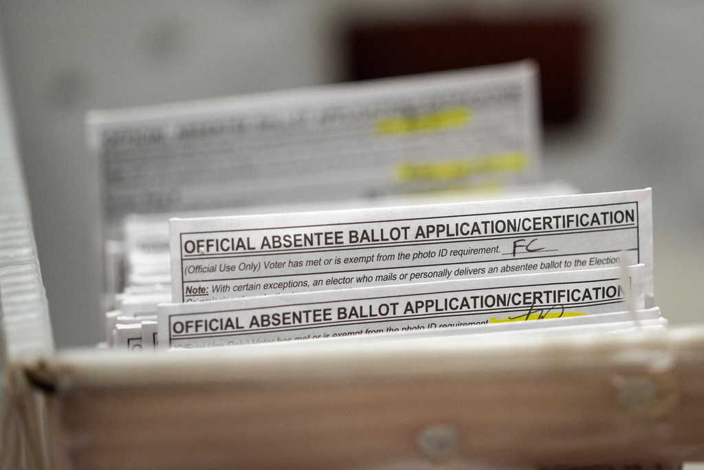 FILE - Absentee ballots during a count at the Wisconsin Center, Nov. 8, 2022, in Milwaukee. (AP Photo/Morry Gash, File)