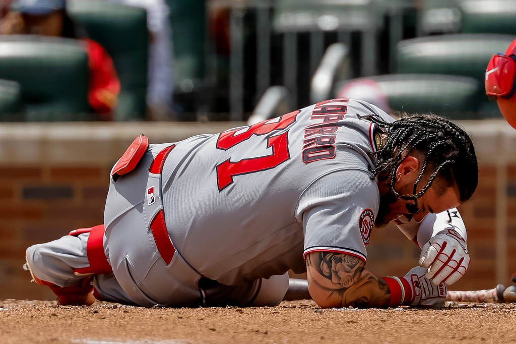Washington Nationals' Andrés Chaparro reacts after getting hit on the helmet by a pitch from Atlanta Braves' JR Ritchie during the fourth inning of a baseball game, Sunday, Aug. 2, 2026, in Atlanta. (AP Photo/Erik S. Lesser)