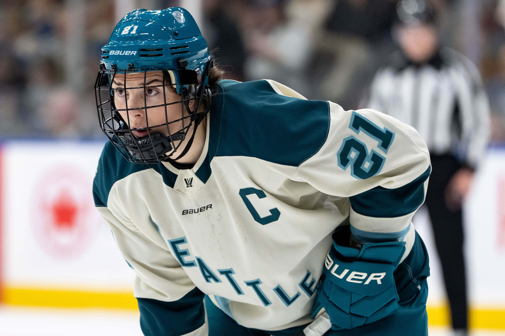 FILE - Seattle Torrent's Hilary Knight (21) waits for a face off against the Vancouver Goldeneyes during the second period of a PWHL hockey game in Vancouver, on Tuesday, April 14, 2026. (Ethan Cairns/The Canadian Press via AP,File)