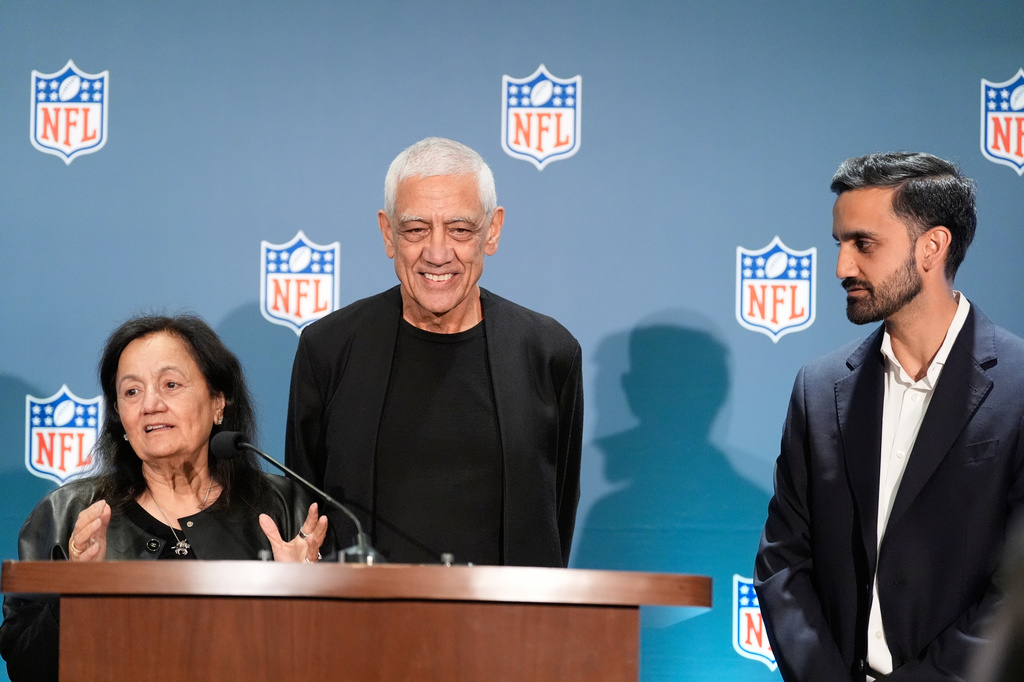 Seattle Seahawks owner's The Khosla family, Neeru Khosla, left, Vinod Khosla, center, and Neal Khosla speak during a news conference during an NFL football owners meeting on Wednesday, Aug. 26, 2026, in Atlanta. (AP Photo/Brynn Anderson)