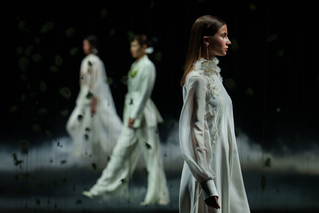 Models wear creations by Xiong Ying - Heaven Gala during China Fashion Week (Spring) 2026 in Beijing, China, Friday, March 20, 2026. (AP Photo/Vincent Thian)
