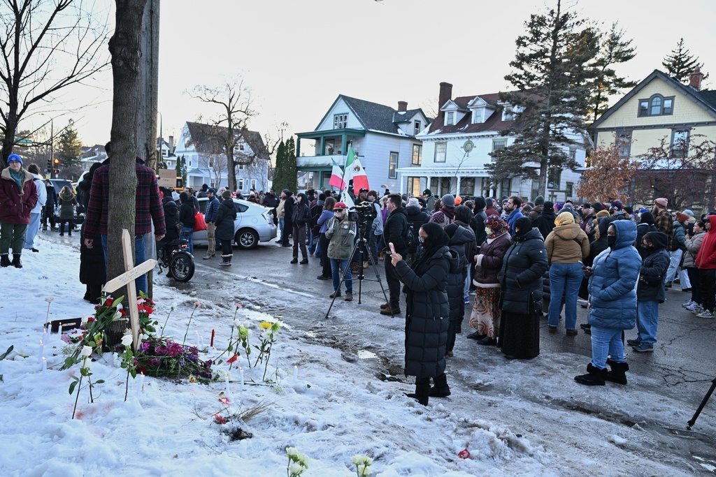 Protesters gather near the scene of the fatal shooting involving federal law enforcement agents, Wednesday, Jan. 7, 2026, in Minneapolis. (AP Photo/Tom Baker)
