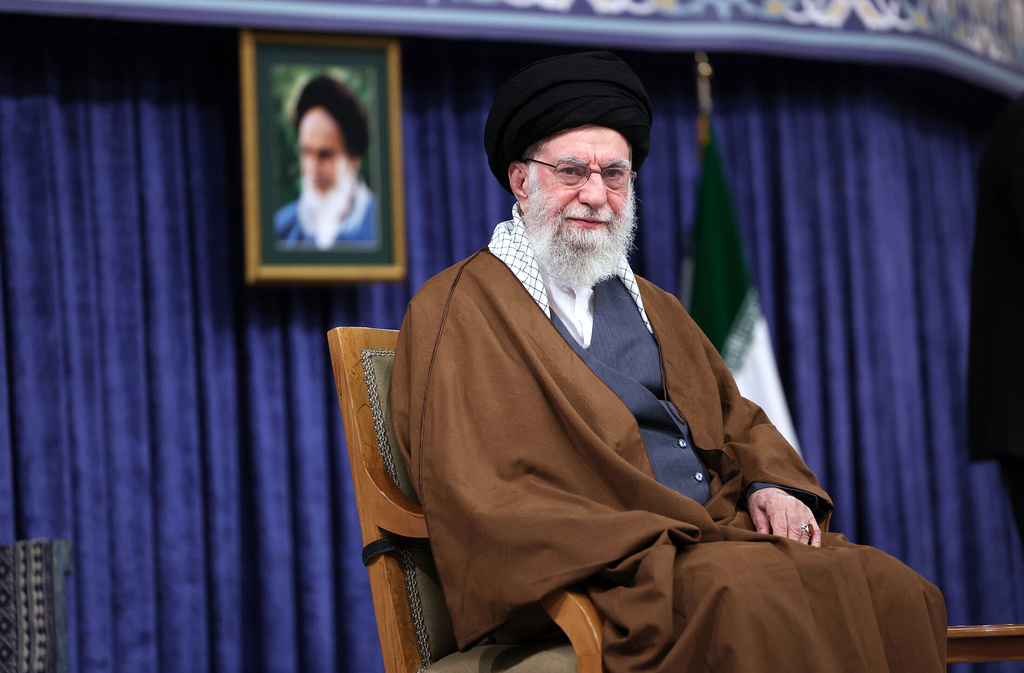In this photo released by the official website of the office of the Iranian supreme leader, Supreme Leader Ayatollah Ali Khamenei listens to a speaker in a meeting in Tehran, Iran, Monday, Oct. 20, 2025. (Office of the Iranian Supreme Leader via AP)