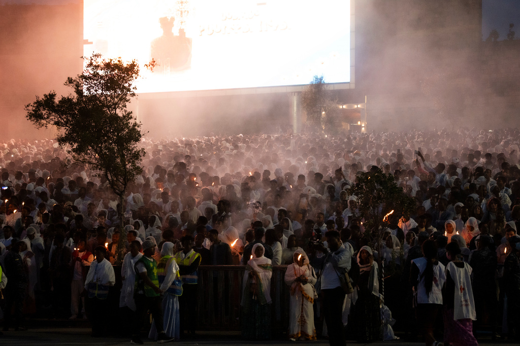 People chant during celebrations for the Orthodox holiday of Meskel, an annual holiday celebrating the discovery of the True Cross in the fourth century by the Roman Empress Helena, in Addis Ababa, Ethiopia, Saturday, Sept. 26, 2026. (AP Photo/Amanuel Sileshi)