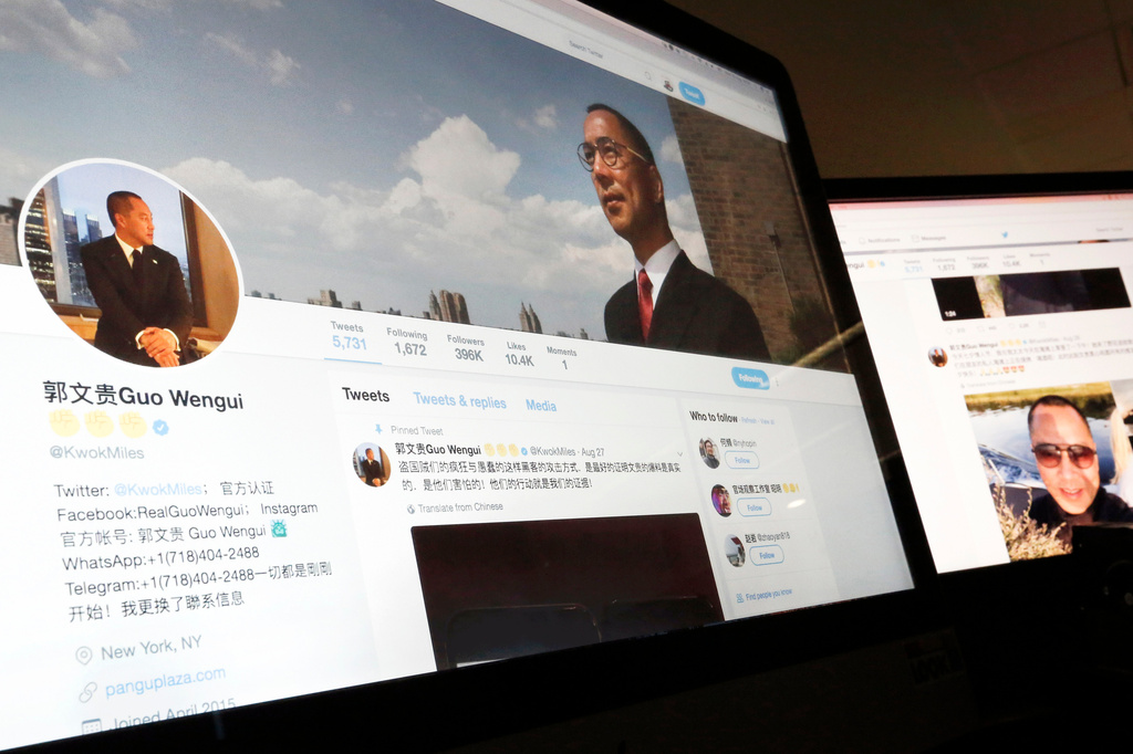 FILE - A Twitter page of Chinese exiled businessman Guo Wengui is seen on a computer screen in Beijing, Aug. 30, 2017. (AP Photo/Andy Wong, File)