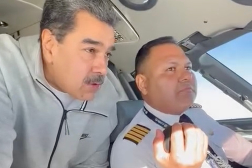 In this image made from a video posted on the Facebook account of Venezuelan President Nicolás Maduro on Dec. 15, 2023, Maduro stands behind pilot Gen. Bitner Villegas in the cockpit of an airplane. (AP Photo) In this image made from a video posted on the Facebook account of Venezuelan President Nicolás Maduro on Dec. 15, 2023, Maduro stands behind pilot Gen. Bitner Villegas in the cockpit of an airplane. (AP Photo)