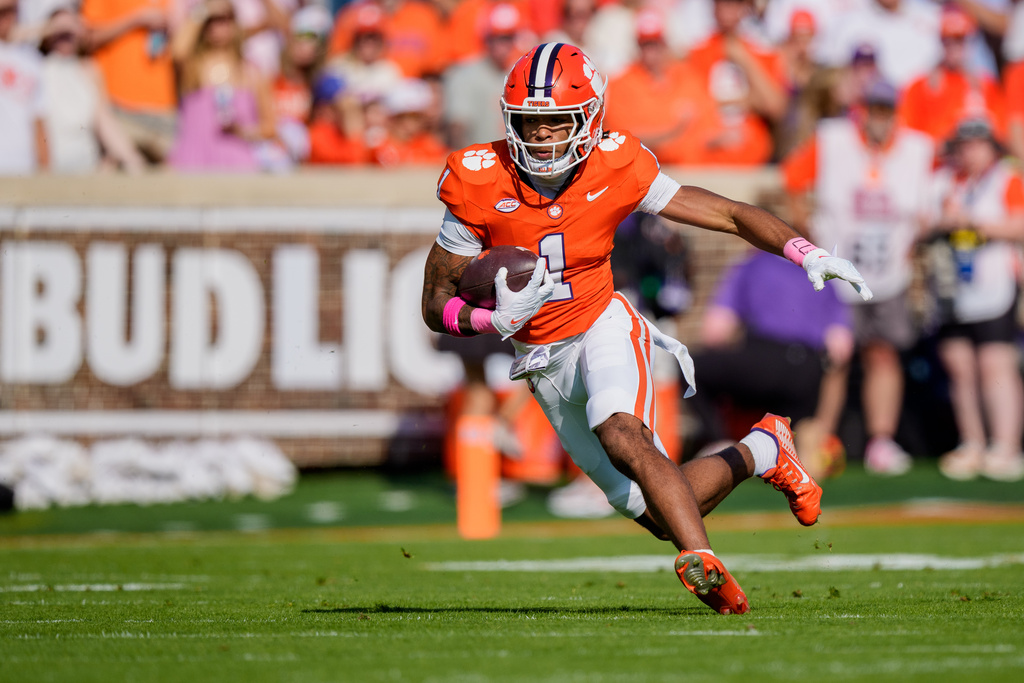 Clemson wide receiver T.J. Moore (1) runs with the ball in the first half of an NCAA college football game against SMU, Saturday, Oct. 18, 2025, in Clemson, S.C. (AP Photo/Jacob Kupferman)