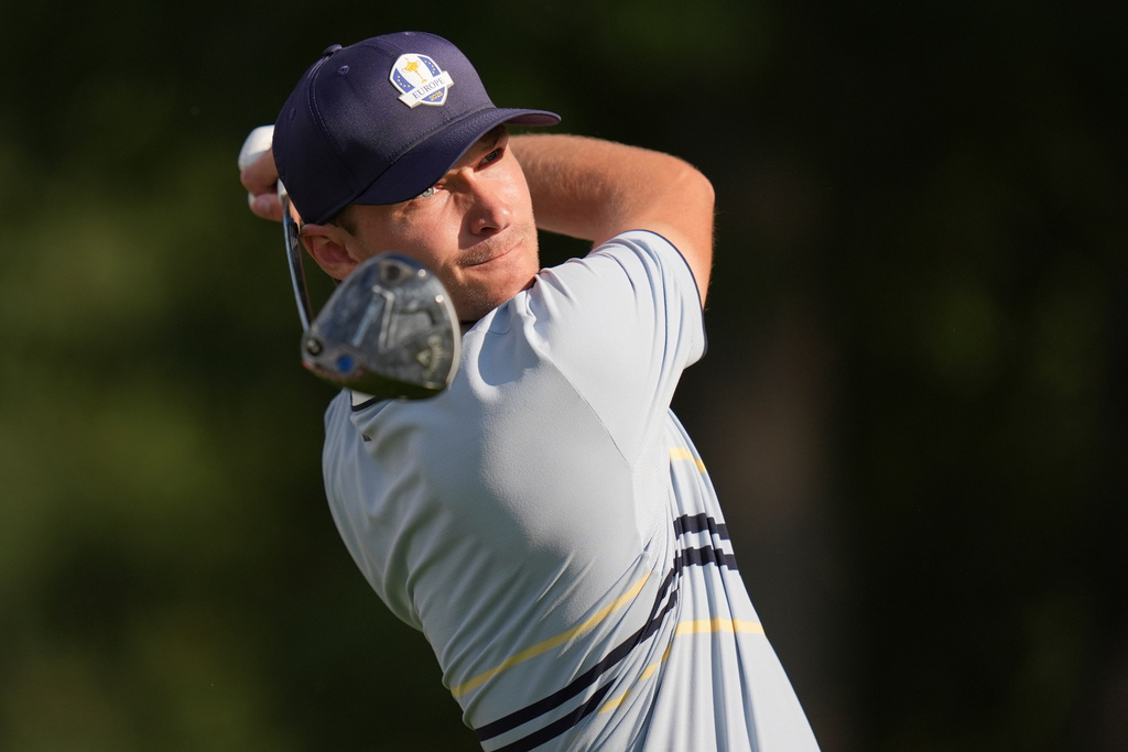 Europe's Rasmus Højgaard watches his tee shot on the 12th hole at Bethpage Black golf course during the Ryder Cup golf tournament, Friday, Sept. 26, 2025, in Farmingdale, N.Y. (AP Photo/Seth Wenig)