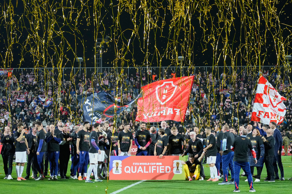 Croat players celebret as they qualified for the World Cup aftre defeating Faroe Islands in Rijeka, Croatia, Friday, Nov. 14, 2025. (AP Photo/Darko Bandic)