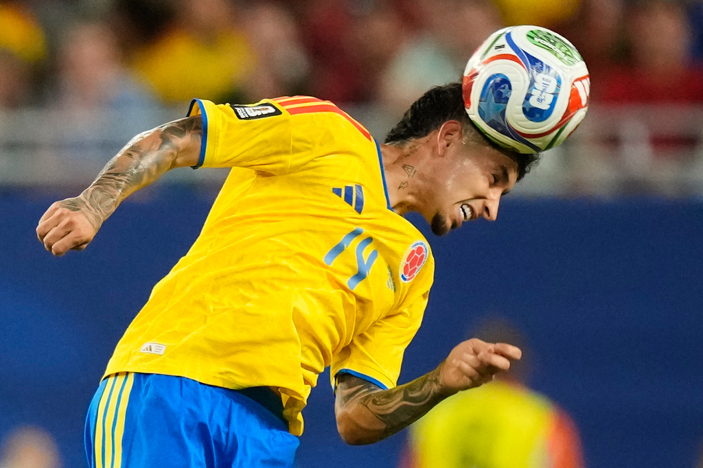 Colombia's Gustavo Puerta (14) heads the ball during the World Cup Group K soccer match between Colombia and Portugal in Miami Gardens, Fla., Saturday, June 27, 2026. (AP Photo/Rebecca Blackwell)