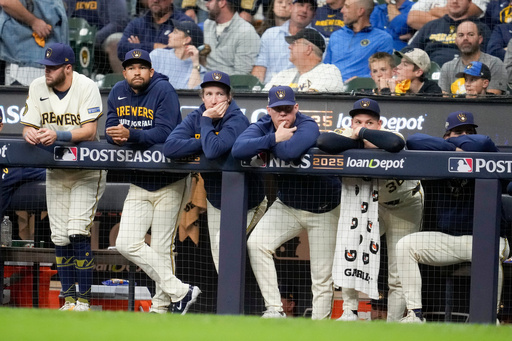 Members of the Milwaukee Brewers watch during the ninth inning in Game 2 of baseball's National League Championship Series against the Los Angeles Dodgers, Tuesday, Oct. 14, 2025, in Milwaukee. (AP Photo/Ashley Landis) Members of the Milwaukee Brewers watch during the ninth inning in Game 2 of baseball's National League Championship Series against the Los Angeles Dodgers, Tuesday, Oct. 14, 2025, in Milwaukee. (AP Photo/Ashley Landis)