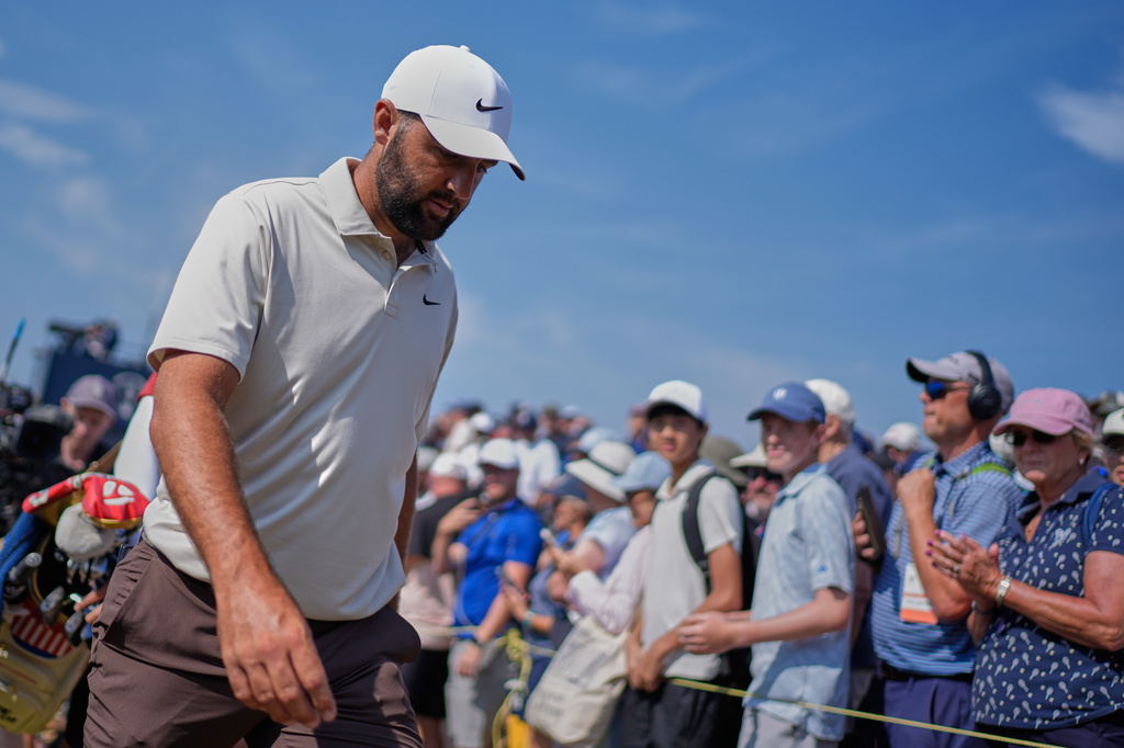 Scottie Scheffler of the United States walks to the 4th tee past applauding fans during the second day of the British Open Golf championships at Royal Birkdale golf club, in Southport, England, Friday, July 17, 2026. (AP Photo/David Goldman)
