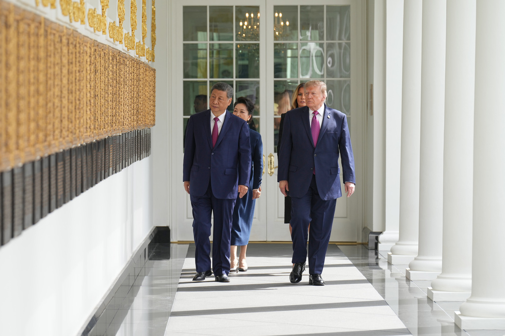 President Donald Trump and China's President Xi Jinping, along with first lady Melania Trump and Peng Liyuan walk along the Colonnade of the White House, Thursday, Sept. 24, 2026, in Washington. (AP Photo/Jacquelyn Martin)