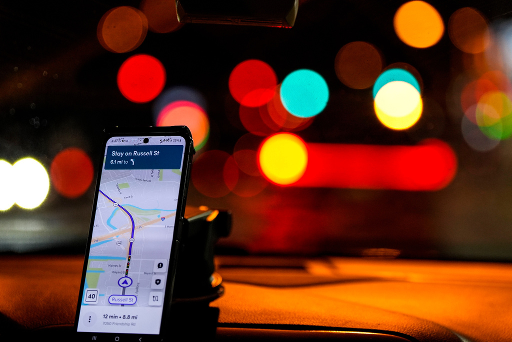 FILE - A Lyft driver takes a customer to the airport, Jan. 29, 2024, in Baltimore. (AP Photo/Mike Stewart, File)